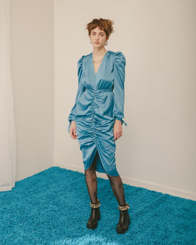 Model wearing a designer Colin Locascio's blue dress