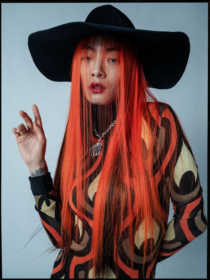 Rina Sawayama wears a Paco Rabanne dress; Bijou Van Ness hat; Bulgari necklace.