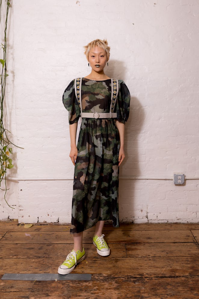 A model wearing a camouflage dress from Dauphinette's Fall 2022 collection.