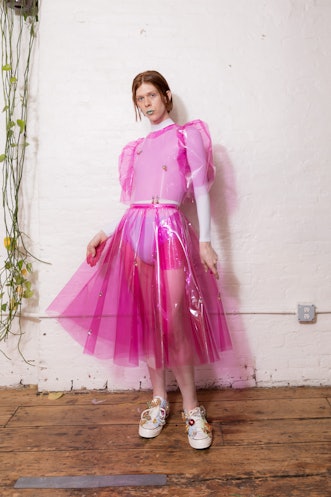 A model wearing a pink dress from Dauphinette's Fall 2022 collection.