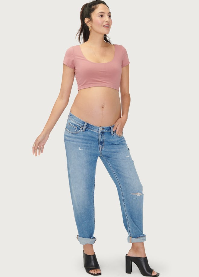 Pregnant woman modeling maternity jeans