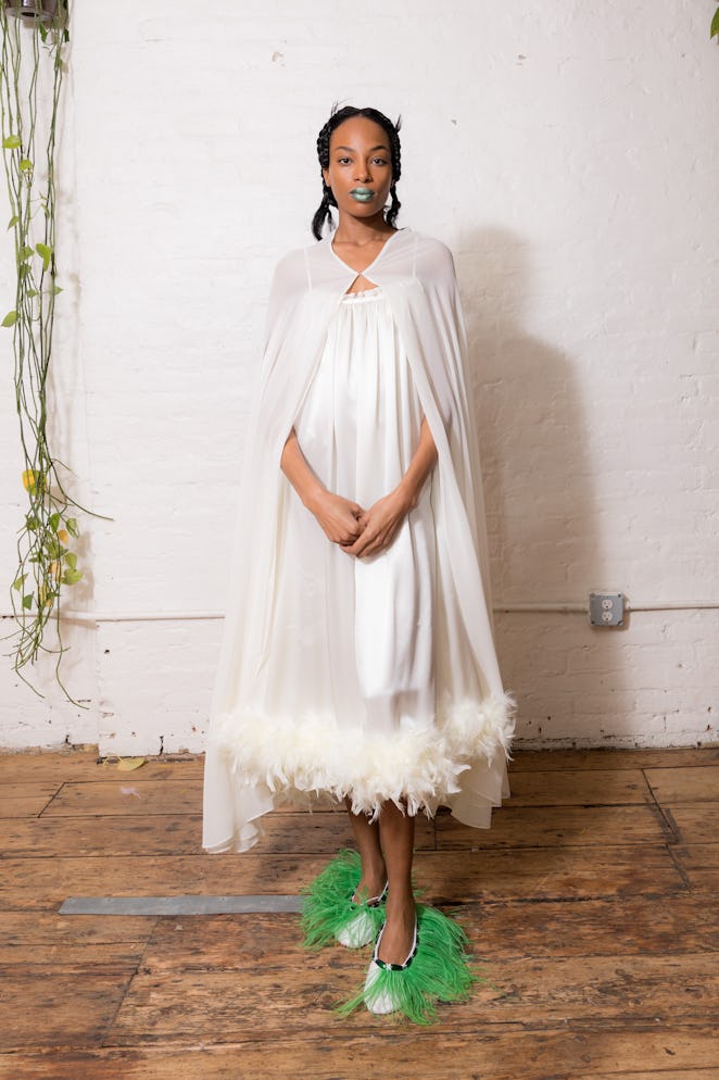 A model wearing a white dress from Dauphinette's Fall 2022 collection.