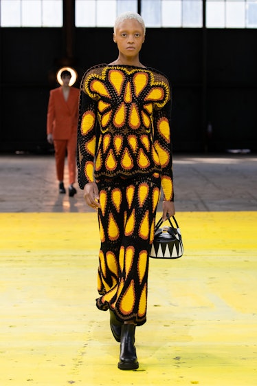 Model on the NY Fashion Week Fall 2022 runway in a Gabriela Hearst knitted flower-like dress