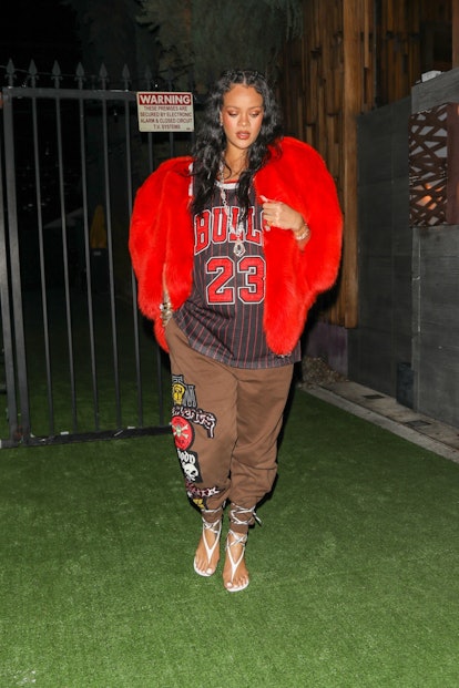 Rihanna wearing a heart-shaped jacket over a Chicago Bulls jersey. 