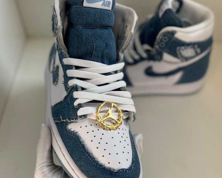 Nike s Denim Air Jordan 1 sneaker comes with the cutest gold hoops