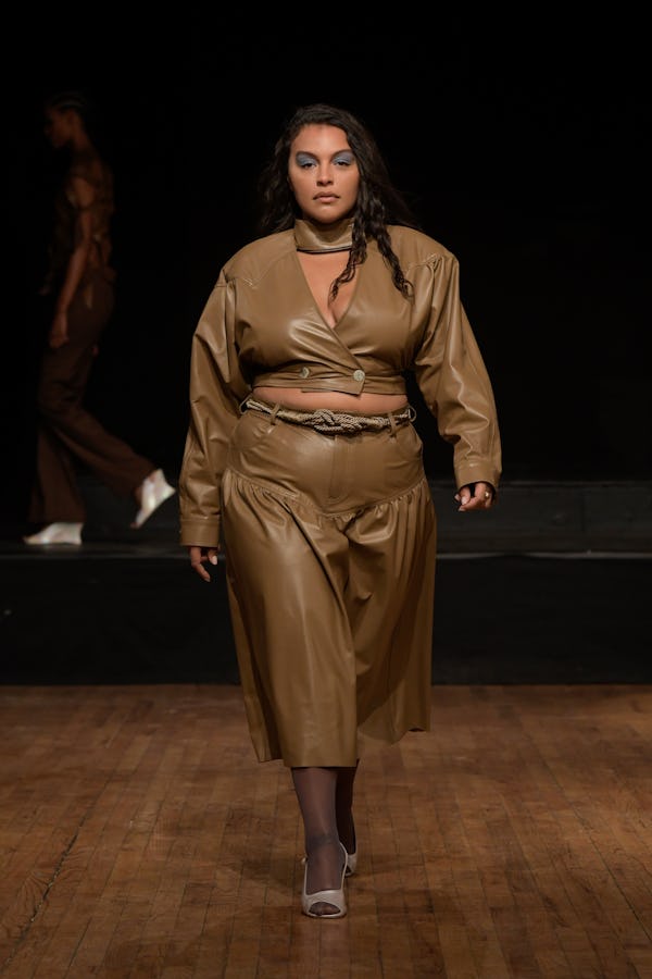 Paloma Elsesser wearing a brown leather crop top and skirt on the Maryam Nassir Zadeh runway