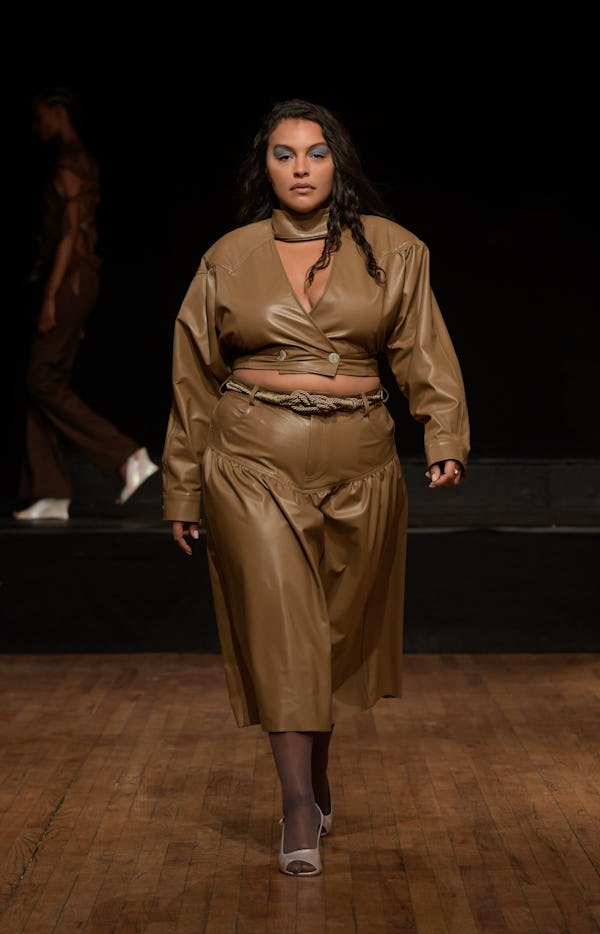 Paloma Elsesser wearing a brown leather crop top and skirt on the Maryam Nassir Zadeh runway