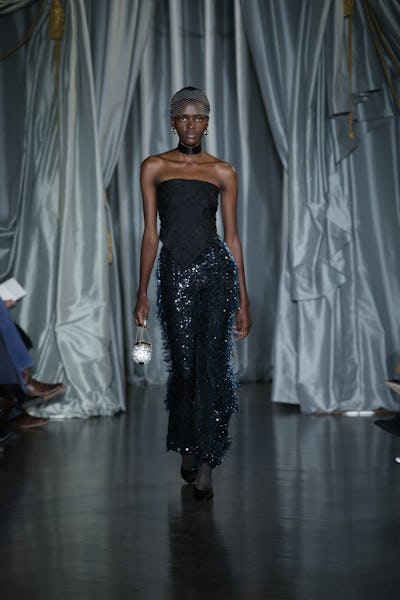 a model wearing beaded and sequin pants on the Markarian runway