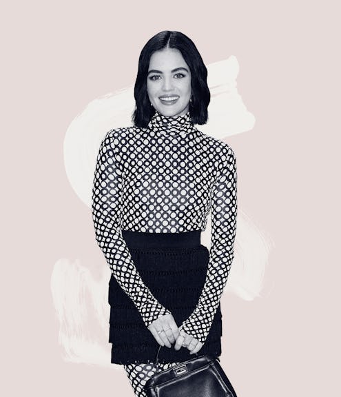 Lucy Hale wearing a patterned top and a black skirt while holding a leather handbag