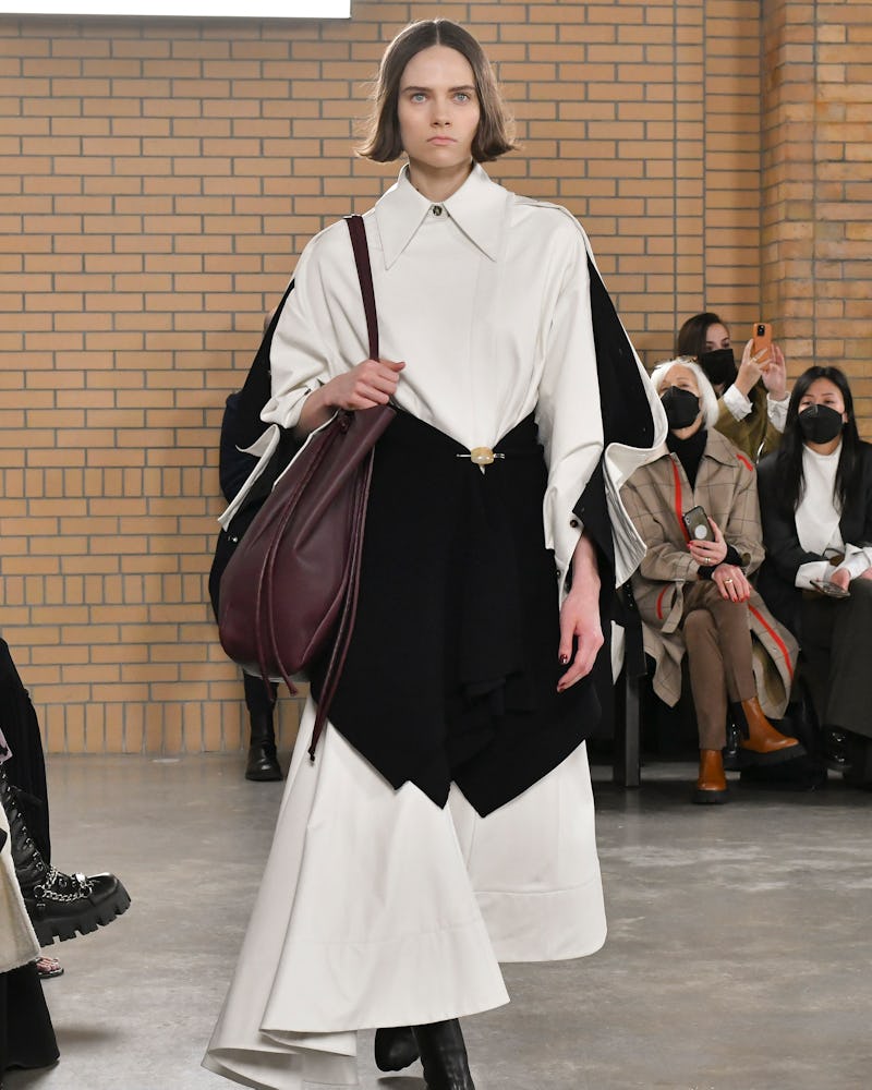 a model wearing a black and white A-line dress on the Proenza Schouler runway