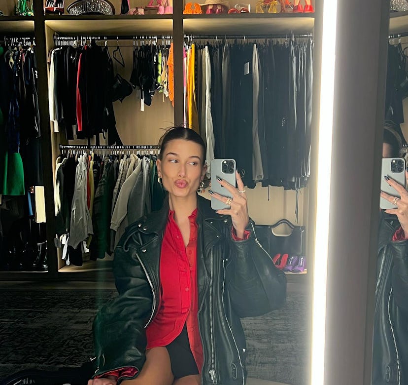 Hailey Bieber wears a black miniskirt.