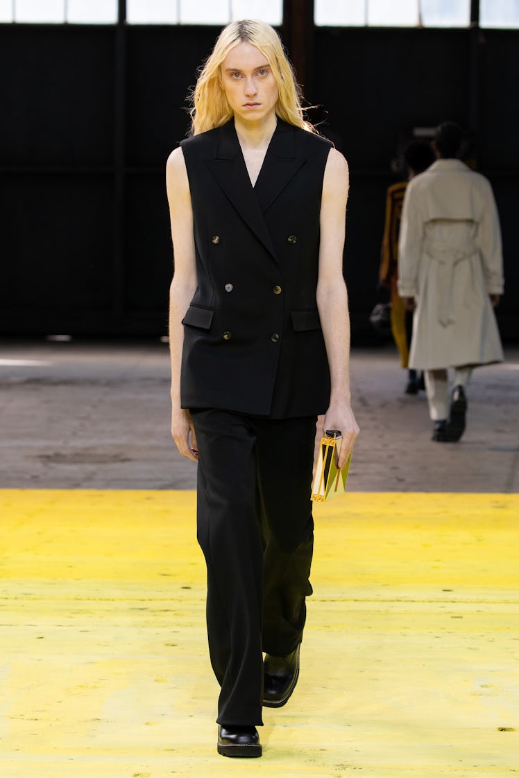 Model on the NY Fashion Week Fall 2022 runway in a Gabriela Hearst black suit with no sleeves