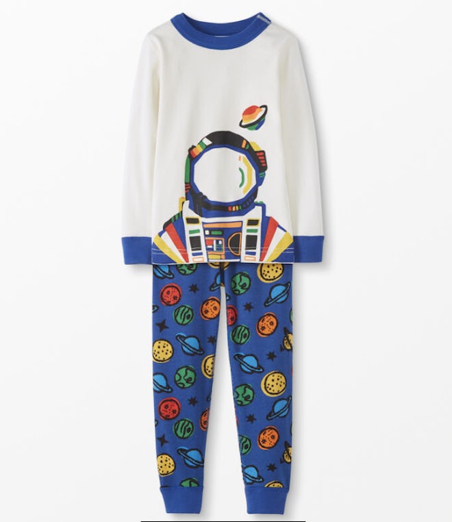 Flat lay of long john-style pjs with astronaut print