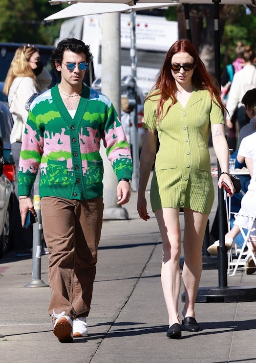 Sophie Turner and Joe Jonas matching in green outfits. 