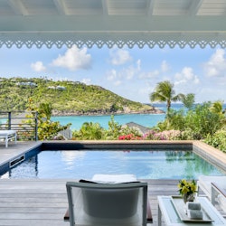 St. Barts Hotel with a view of the island from the side of a pool