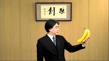 Satoru Iwata holding bananas