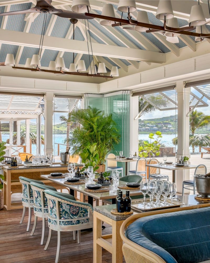 Rosewood le Guanahani, set dining room with a ocean view