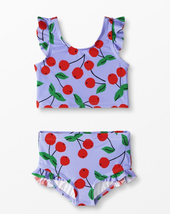 Flat Lay of kids two-piece swimsuit with cherry print