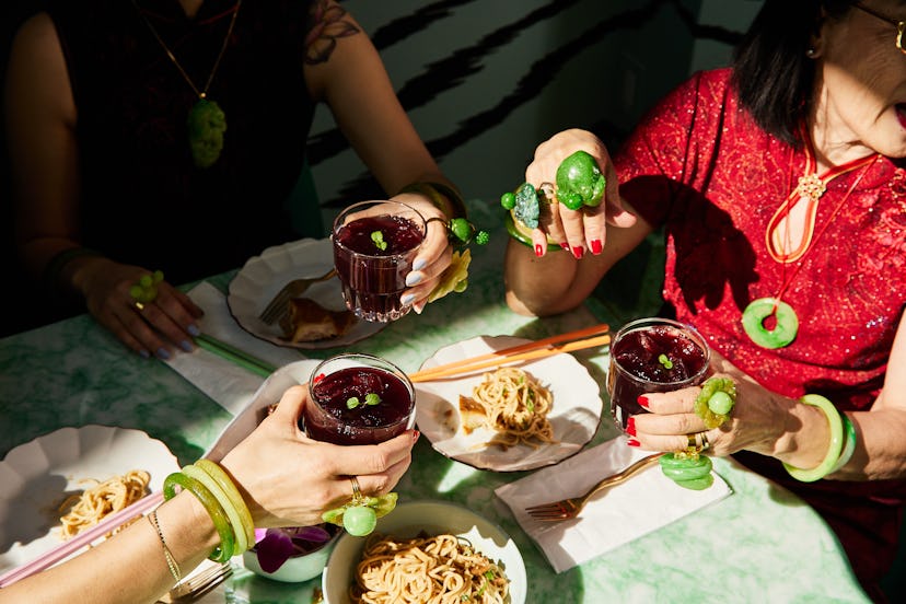 Women eating wearing jade jewelry