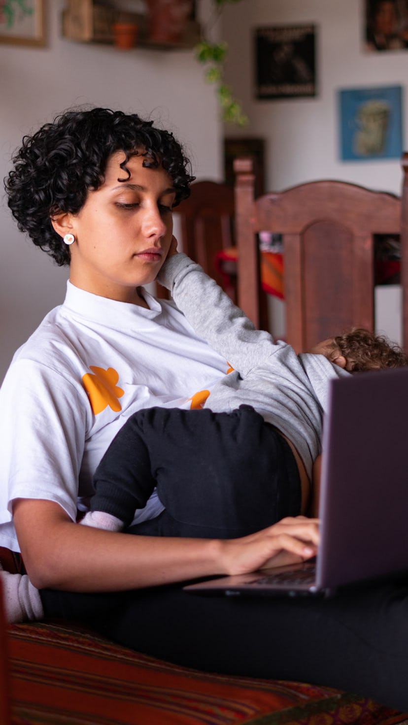 A woman working from home after having a baby.