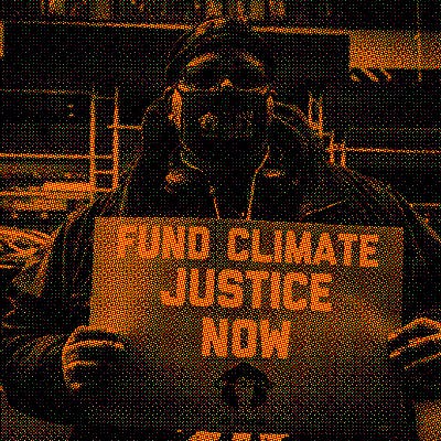 A man protesting for climate justice in New York City in January 2022.