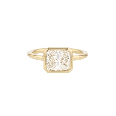 east west bezel set radiant cut engagement ring in yellow gold