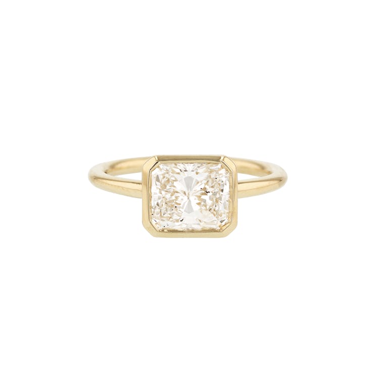 east west bezel set radiant cut engagement ring in yellow gold