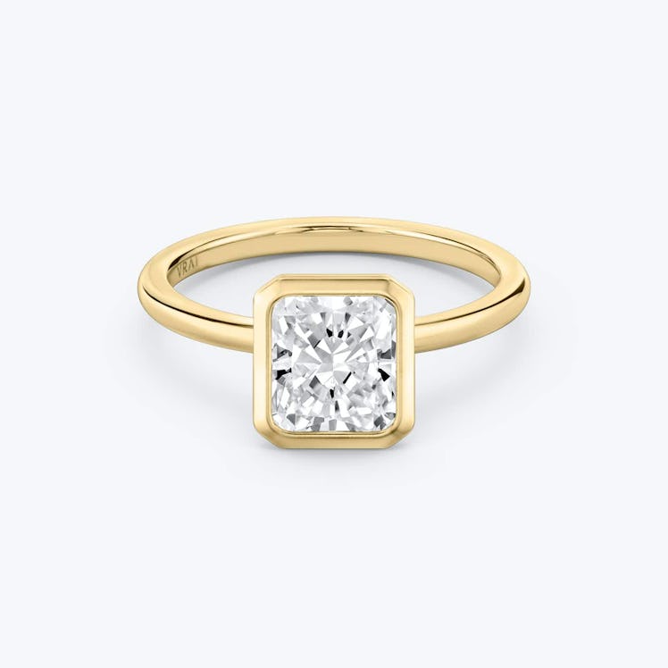 bezel set solitaire radiant engagement ring in yellow gold