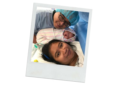 New parents and their newborn, in hospital bed