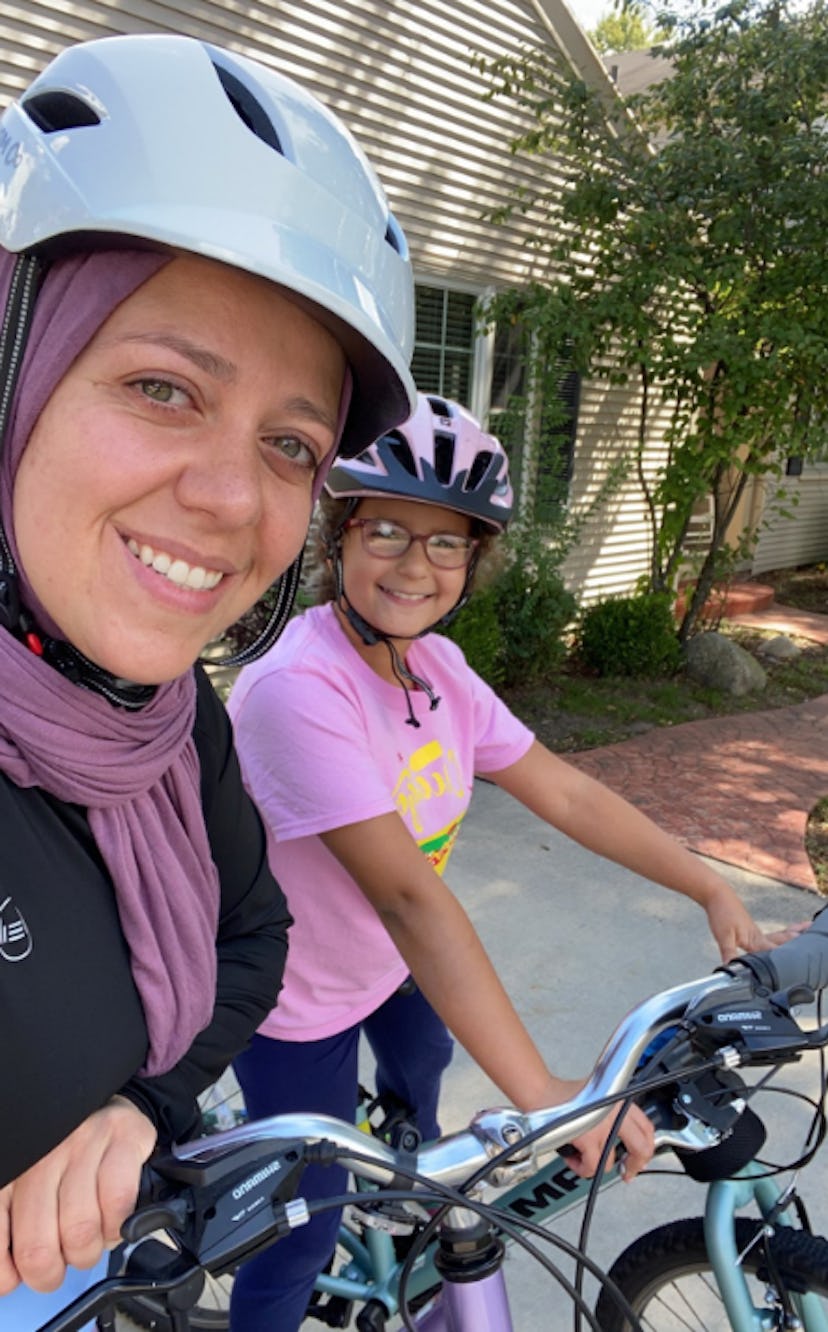 Aya and her daughter ride bikes