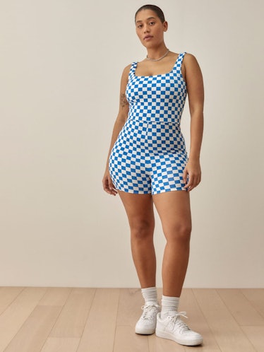 a blue and white checkerboard print workout romper