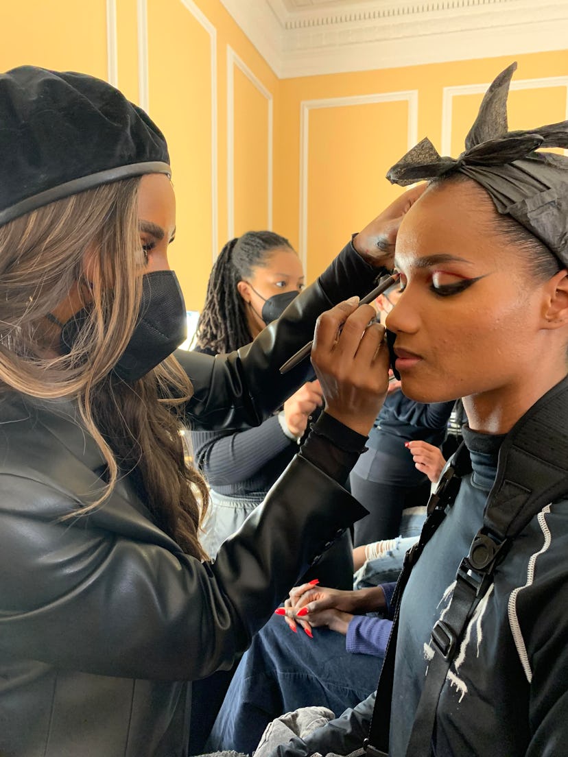 It's New York Fashion Week and Bustle went backstage at LaQuan Smith F/W 2022 to get details on the ...