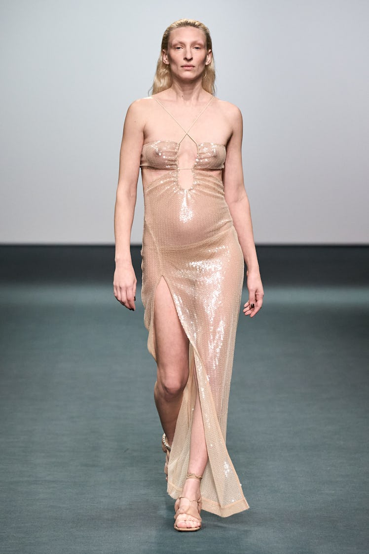 A model in a beige sequin dress by Nensi Dojaka at the London Fashion Week Fall 2022