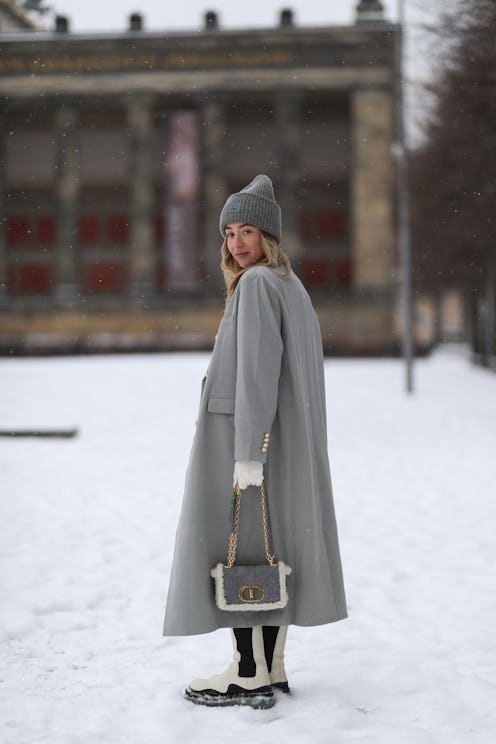Sonia Lyson wears a snow boot outfit.