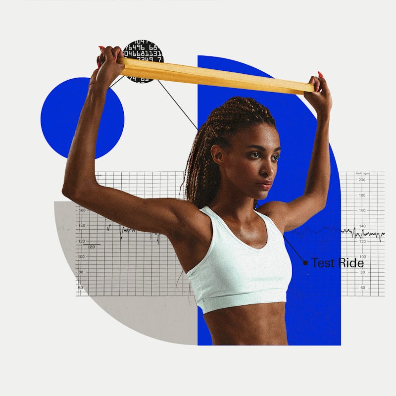 A woman trying out Extend Barre exercise while wearing a white workout top