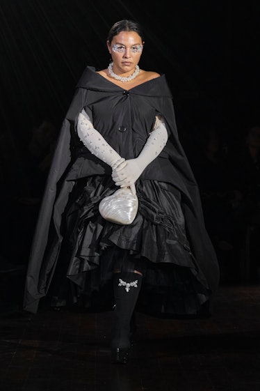 Paloma Elsesser in black dress and white gloves