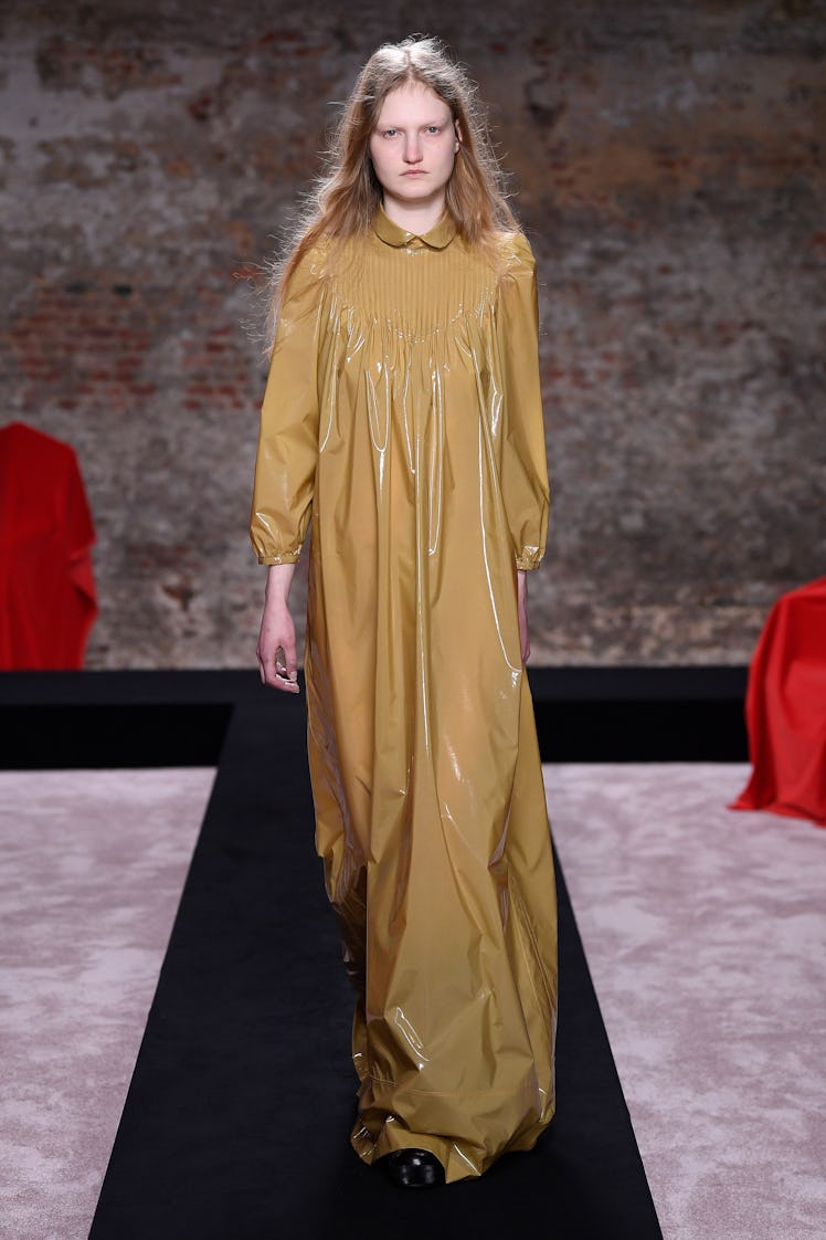 A model in a beige gown by Raf Simons at the London Fashion Week Fall 2022