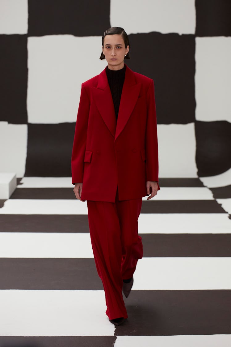 A model in a red Emilia Wickstead suit  at the London Fashion Week Fall 2022