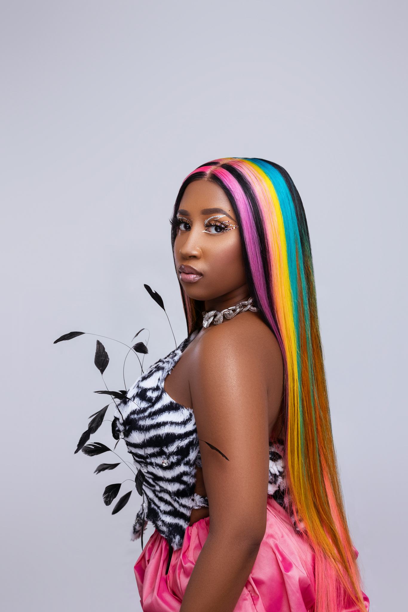 Scrill Davis in zebra pattern top and pink skirt at the cover of NYLON's Soundcheck article.