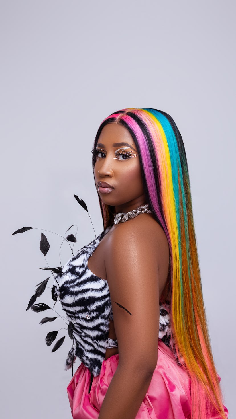 Scrill Davis in zebra pattern top and pink skirt at the cover of NYLON's Soundcheck article.