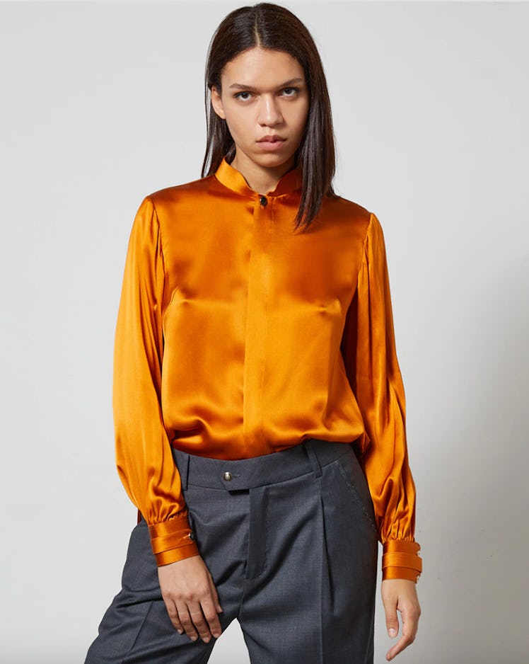 Lucie Brochard's SKY B orange silk blouse. 