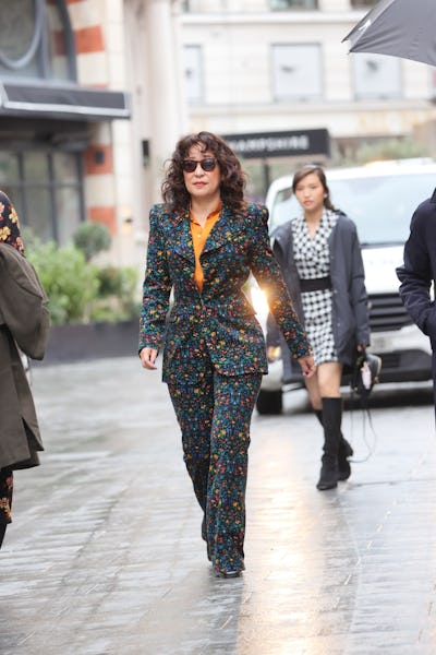 Sandra Oh wearing a floral pantsuit. 