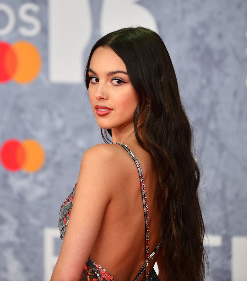 Olivia Rodrigo looking over her shoulder