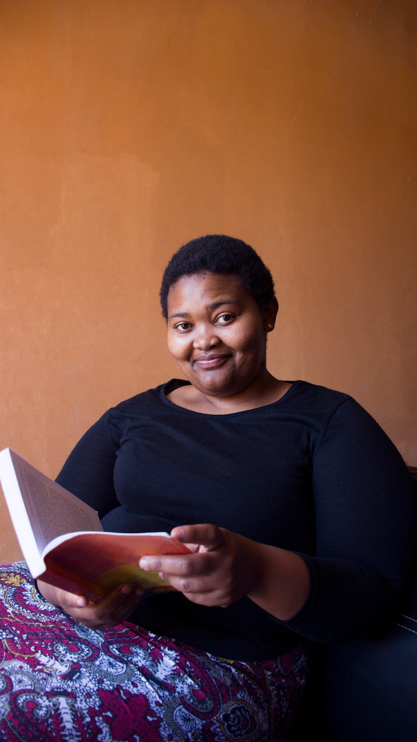 Young woman reading a book, since she's one of the zodiac signs who love to read most.