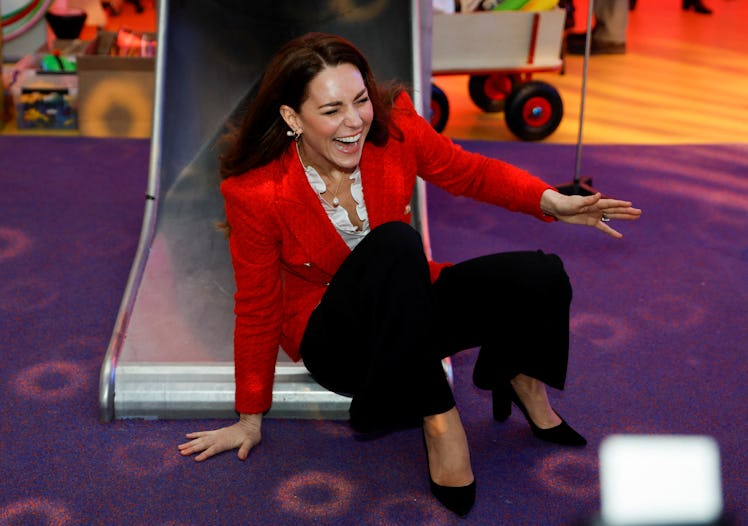 Kate Middleton going down a slide
