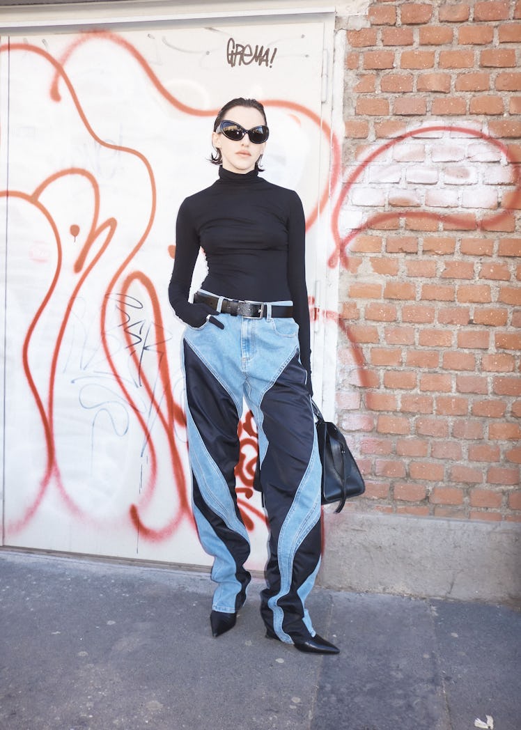 A person wearing striped jeans at Milan Fashion Week