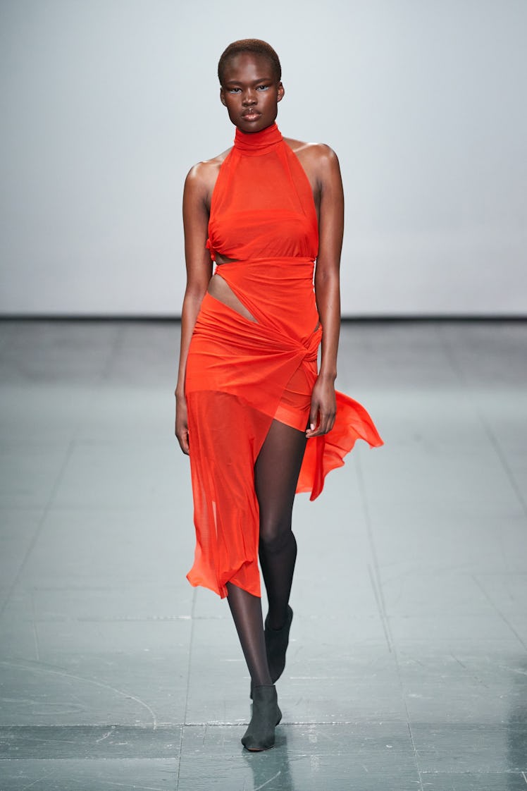 A model wearing an orange Supriya Lele dress at the London Fashion Week Fall 2022