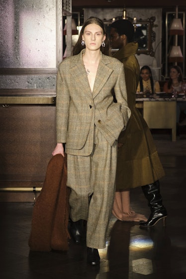 Model in suit at Rejina Pyo fall 2022 show