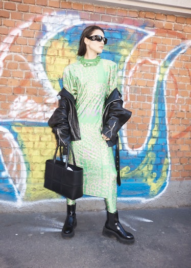 A person wearing a green dress at Milan Fashion Week