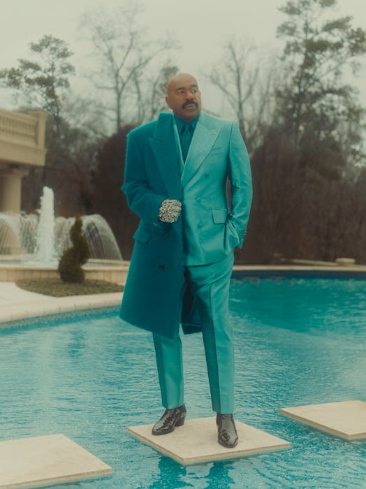Steve Harvey in a teal outfit in PAPER Magazine 